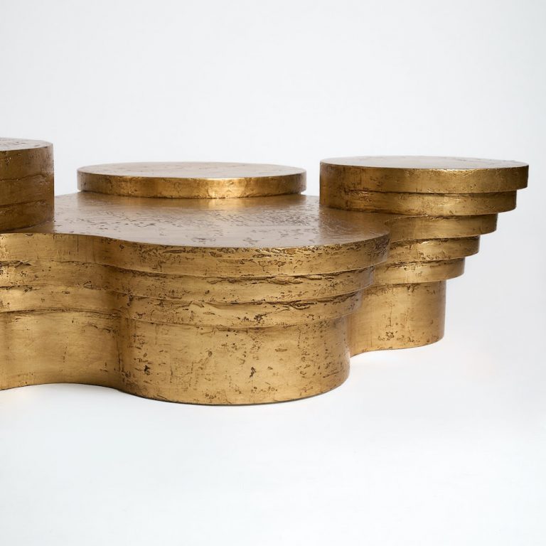 A minimalist coffee table with hand-applied golden leaf