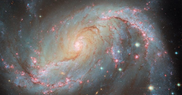 Spiral Galaxy 50 Million Light-Years Away Delivers Stellar Light Show