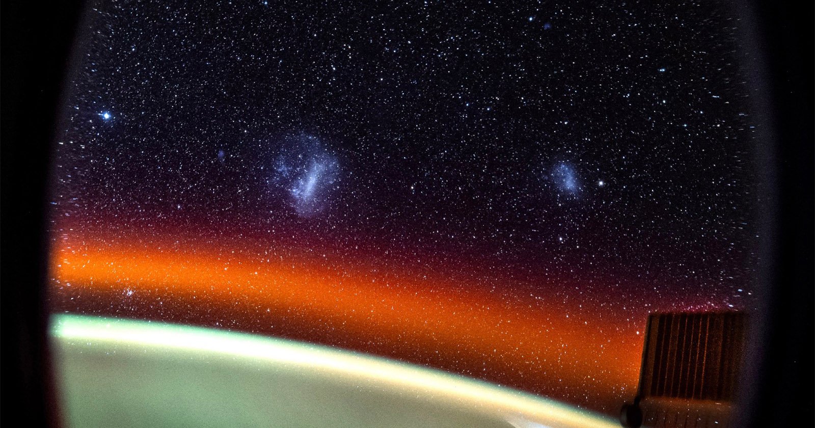 Astronaut Takes Epic Photo of Two Satellite Galaxies From Onboard the ISS