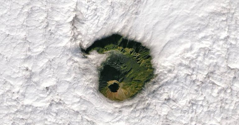 Amazing Satellite Image Shows Mount Vesuvius Peeking Through the Clouds