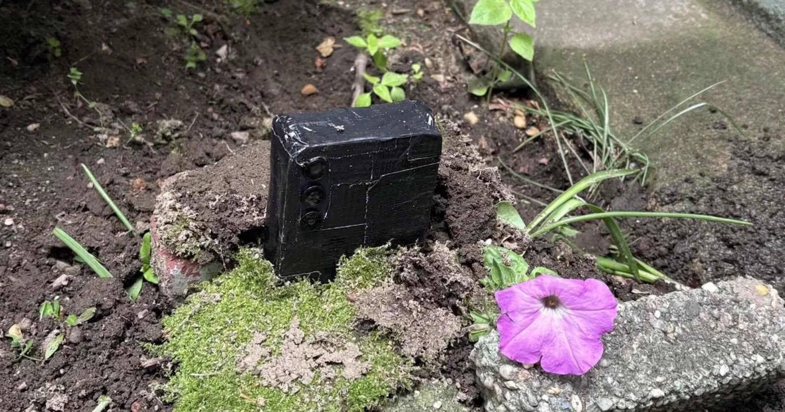 NYC Homeowner Finds Hidden Phone Camera Covered in Duct Tape Buried in Front Lawn NYC Homeowner Finds Hidden Phone Camera Covered in Duct Tape Buried in Front Lawn