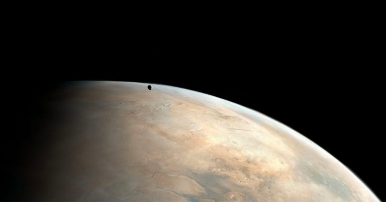 Stunning Photos Capture Martian Moon Hovering Above the Red Planet’s Surface